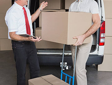 pngtree-discussion-between-a-warehouse-manager-and-a-delivery-driver-next-to-a-delivery-van-photo-image_29075480